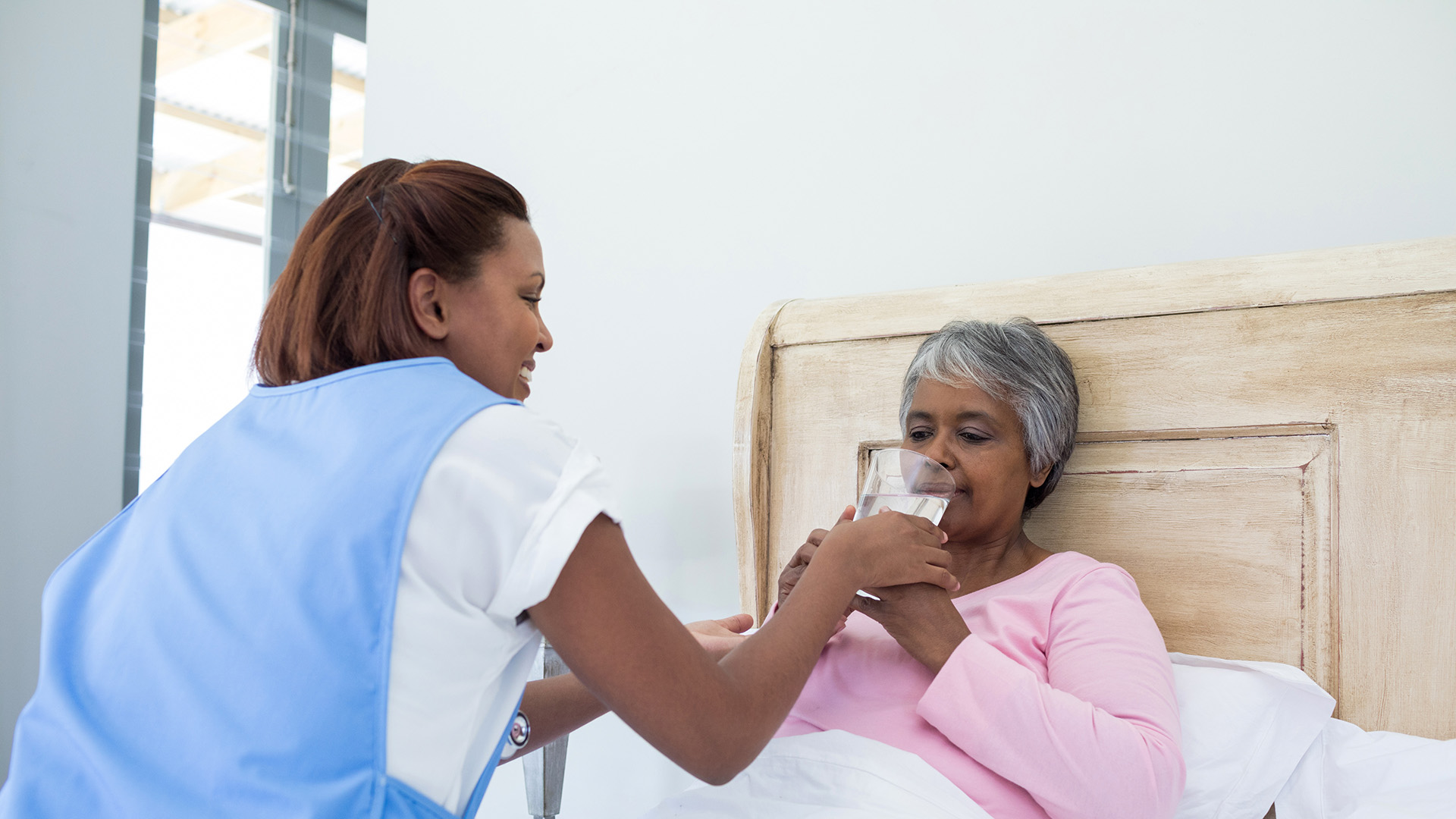 Domiciliary care professional providing in-home support